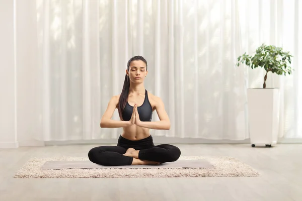 Young female meditating at home — Stock Photo, Image