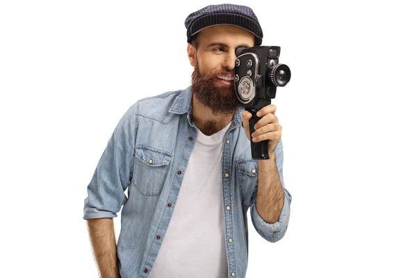 Baard man opname met een vintage 8 mm camera — Stockfoto