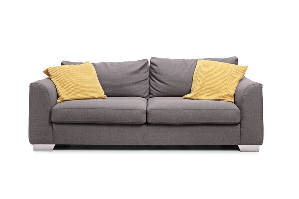 Studio shot of a gray sofa with yellow cushions isolated on white background