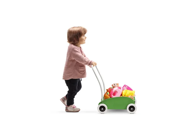 Full Length Profile Shot Little Girl Pushing Cart Toys Isolated — Stock Photo, Image