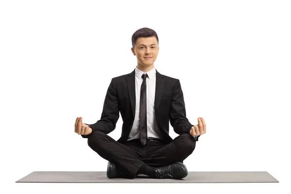 Young Guy Black Suit Sitting Crossed Legs Making Meditation Pose — Stock Photo, Image