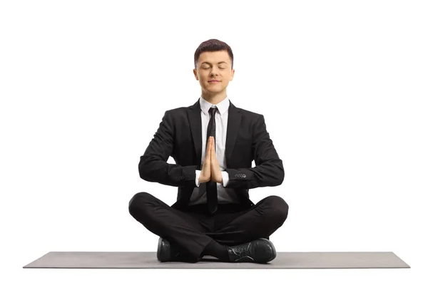 Young Man Black Suit Closed Eyes Sitting Crossed Legs Meditating — Stock Photo, Image