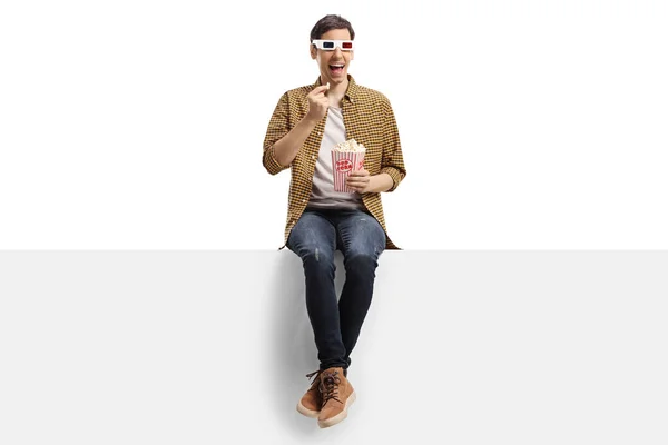 Young Man Glasses Sitting Panel Eating Popcorn Isolated White Background — Stock Photo, Image