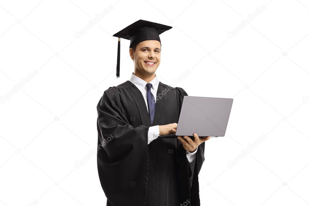 Male graduate holding a laptop computer and smiling at the camera isolated on white background