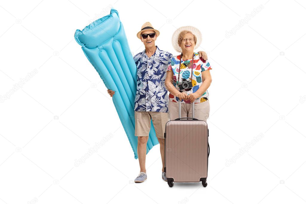 Full length portrait of senior man and woman on a summer holiday isolated on white background