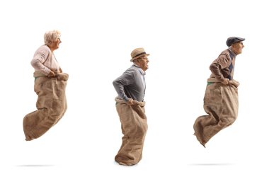 Senior people playing gunny race and jumping in a sack isolated on white background clipart
