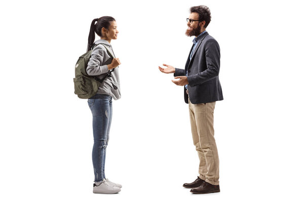 Full length profile shot of a female student and a bearded man having a conversation isolated on white background