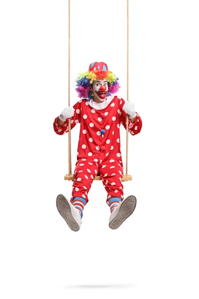 Веселый Смешной Клоун Играет Деревянных Качелях Белом Фоне — стоковое фото