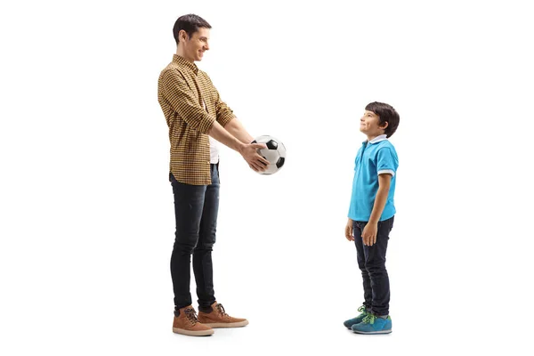 Full Length Shot Young Man Giving Soccer Ball Boy Isolated — Stock Photo, Image