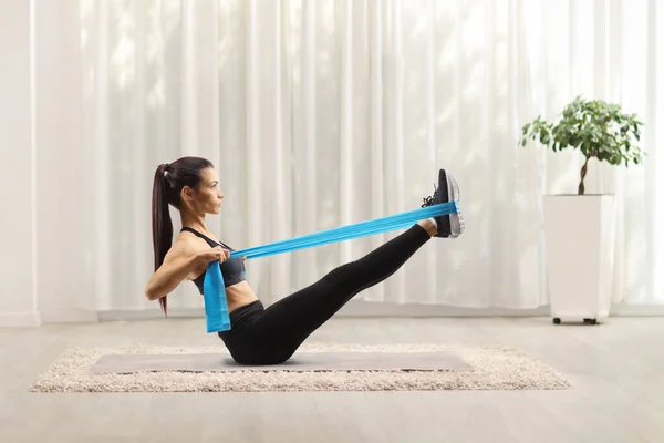 Young Woman Exercising Elsatic Band Floor Home — Stock Photo, Image