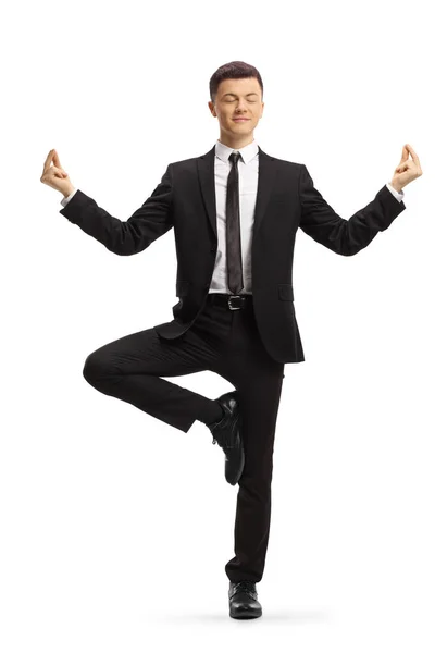 Full Length Portrait Young Businessman Standing Meditating Isolated White Background — Stock Photo, Image