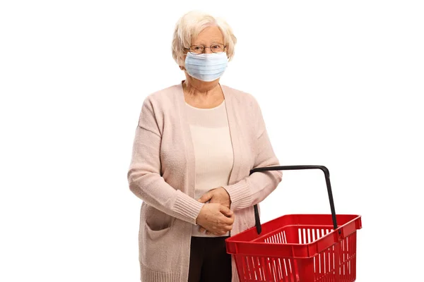 Mulher Idosa Com Máscara Médica Protetora Segurando Uma Cesta Vazia — Fotografia de Stock