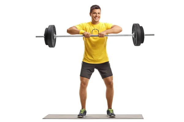Ganzkörperporträt Eines Jungen Mannes Der Gewichte Auf Einer Trainingsmatte Hebt — Stockfoto