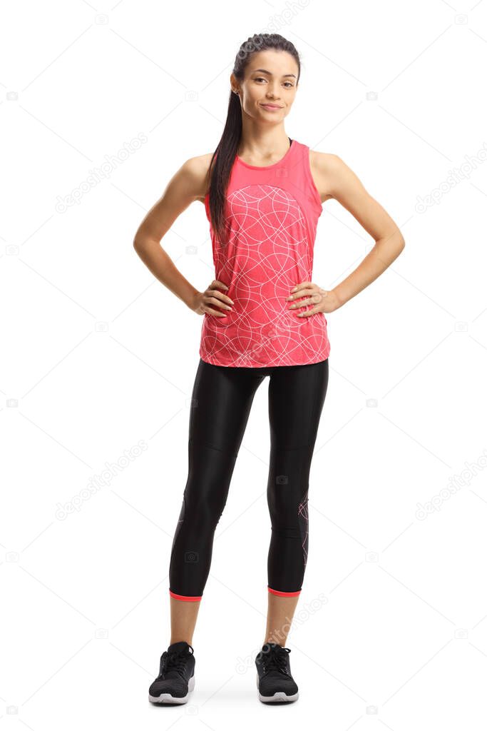 Full length portrait of a young slim female in sportswear isolated on white background