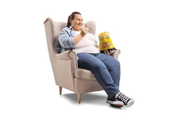 Overweight Woman Sitting Armchair Eating Tortilla Chips Isolated White Background — Stock Photo, Image