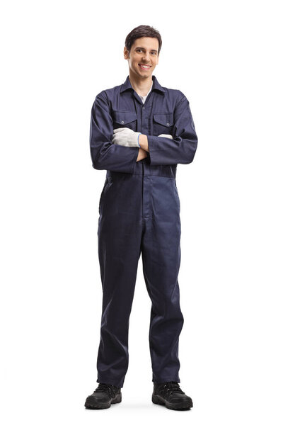 Full length portrait of a male worker in a uniform smiling and posing with crossed arms isolated on white background