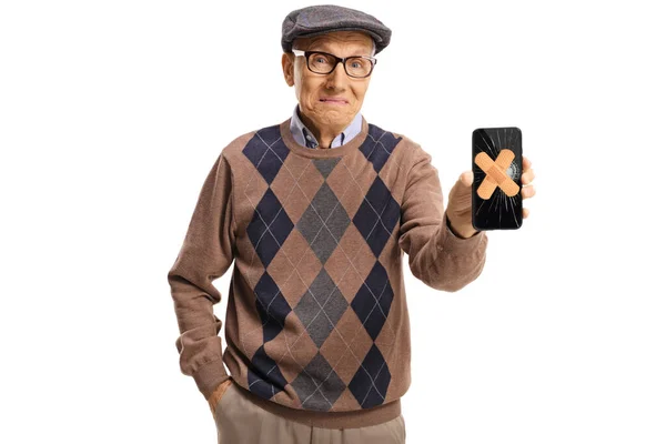 Overstuur Senior Man Met Een Telefoon Met Pleisters Het Gebroken — Stockfoto