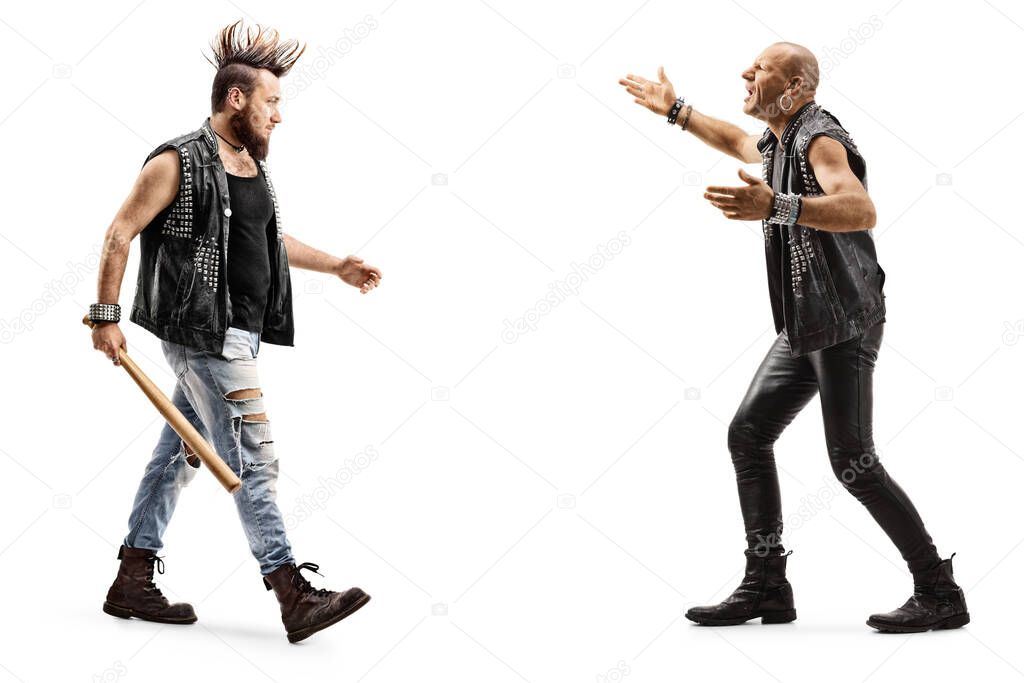 Full length profile shot of angry punk men arguing isolated on white background