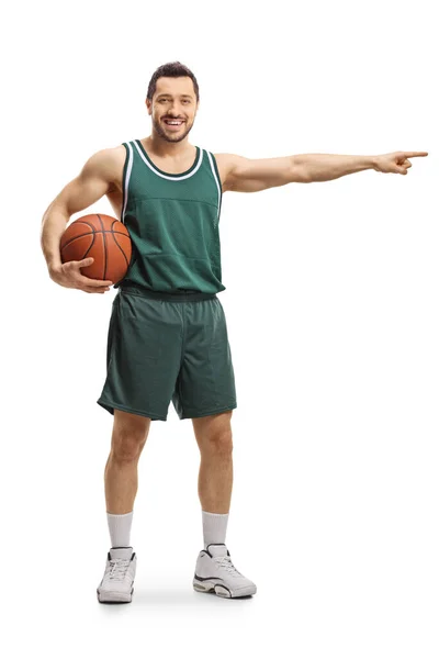 Retrato Completo Jugador Baloncesto Sosteniendo Una Pelota Apuntando Hacia Lado —  Fotos de Stock