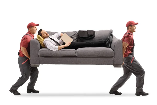 Geschäftsmann Schläft Auf Einem Sofa Mit Einem Buch Während Mover — Stockfoto