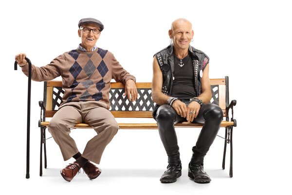 Punk and senior man sitting on a bench isolated on white background