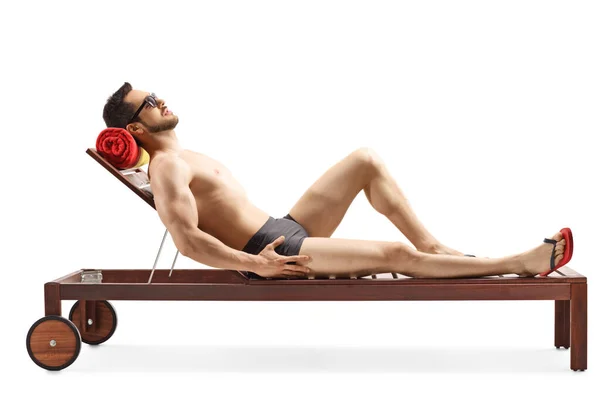 Fit Young Man Lying Wooden Sunbed Swimwear Isolated White Background — Stock Photo, Image