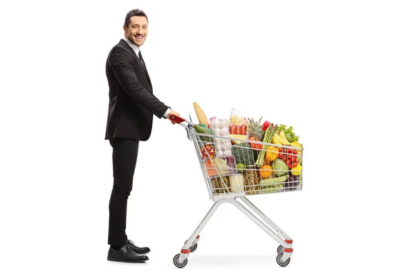 Vollständige Profilaufnahme Eines Geschäftsmannes Mit Einem Einkaufswagen Auf Weißem Hintergrund — Stockfoto
