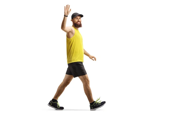 Man Met Baard Sportkleding Lopen Zwaaien Naar Camera Geïsoleerd Witte — Stockfoto