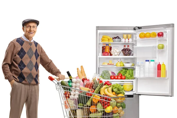 Caballero Anciano Con Carrito Lleno Comida Parado Frente Refrigerador Aislado —  Fotos de Stock