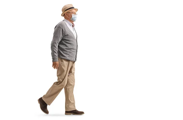 Full Length Profile Shot Eldelry Man Walking Wearing Protective Medical — Zdjęcie stockowe