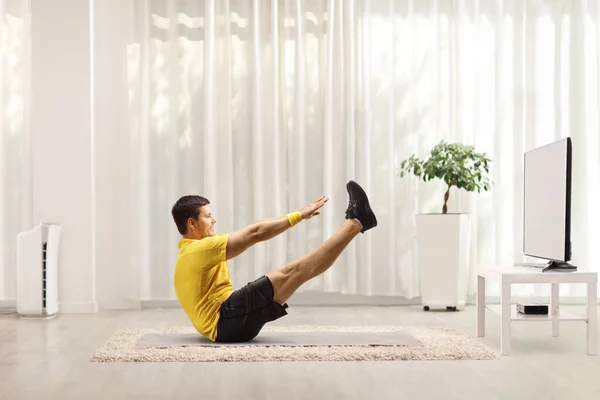 Man Doing Stretching Exercises Front Home — Stock Photo, Image