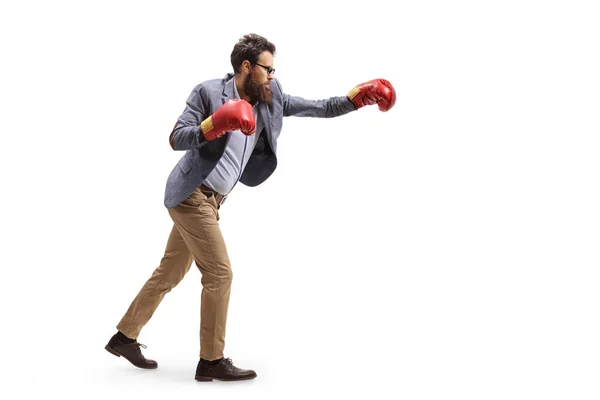 Man in formal clothes boxing with gloves isolated on white background