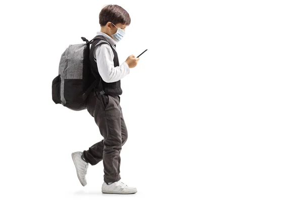 Full Length Shot Schoolboy Face Mask Mobile Phone Walking Isolated — Stock Photo, Image