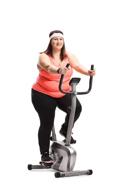 Young Overweight Woman Riding Stationary Bike Looking Camera Isolated White — Stock Photo, Image
