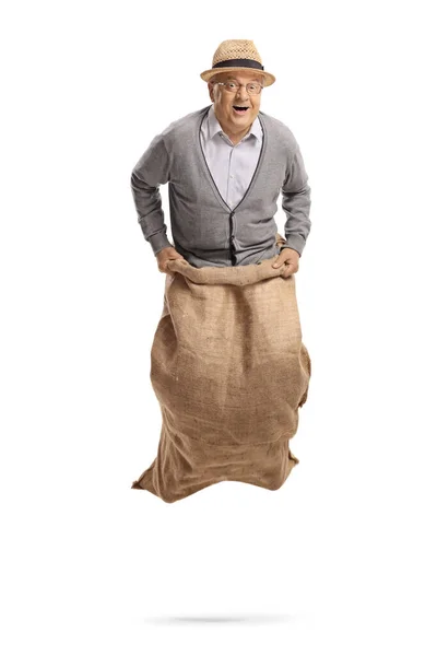 Excited Elderly Man Jumping Sack Isolated White Background — Stock Photo, Image