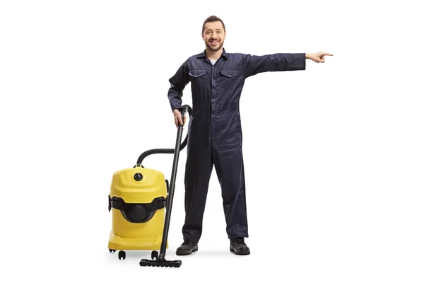 Full Length Portrait Male Worker Cleaning Cervice Hoovering Machine Pointing — Stock Photo, Image