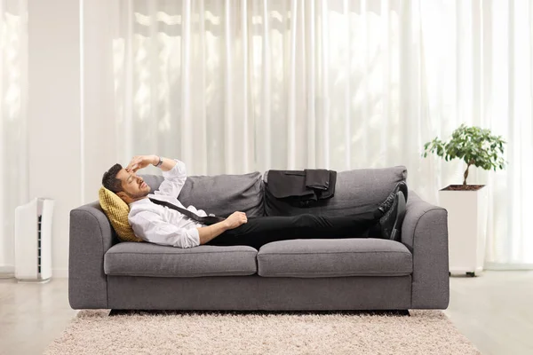 Tired Man Holding His Head Lying Couch Home Work — Stock Photo, Image