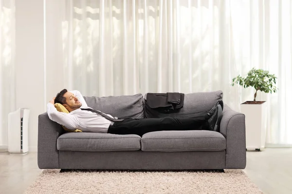 Businessman Resting Gray Sofa Home Living Room — Stock Photo, Image