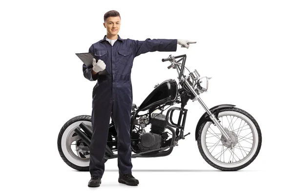 Full Length Portrait Mechanic Standing Next Chopper Motorbike Pointing Isolated — Stock Photo, Image