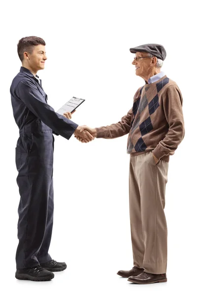 Full Length Profile Shot Young Mechanic Shaking Hands Cheerful Elderly — Stock Photo, Image