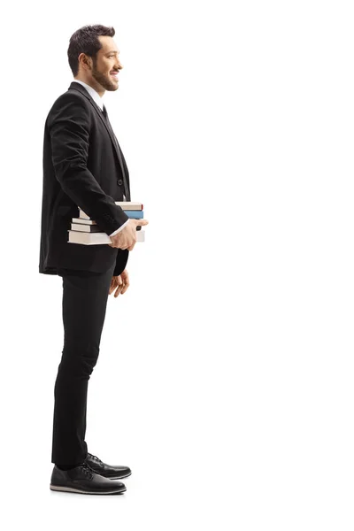 Полнометражный Снимок Человека Черном Костюме Держащего Книги Белом Фоне — стоковое фото