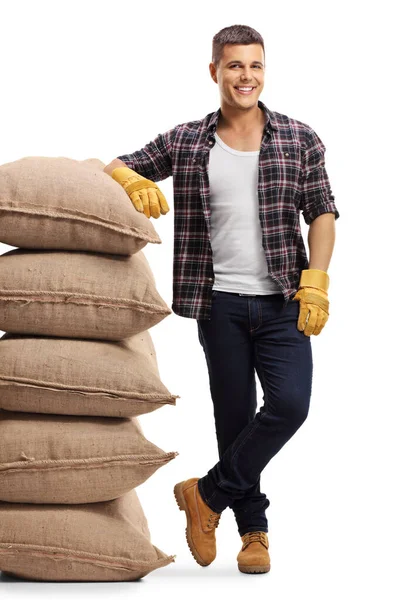 Full Length Portrait Farmer Leaning Pile Sacs Isolated White Background — Stock Photo, Image