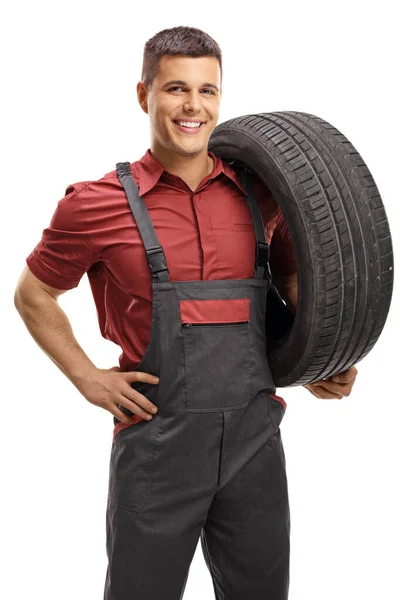 Auto Mechanic Carrying Tire Smiling Camera Isolated White Background — Stock Photo, Image