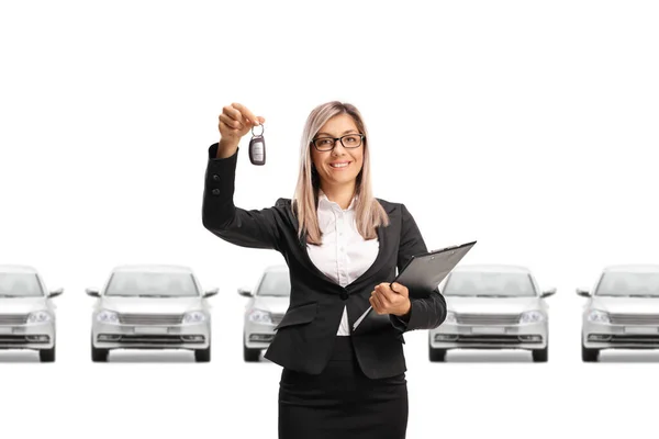 Professional Sales Woman Showing Car Keys Row Cars Isolated White — Stock Photo, Image