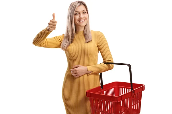 Young Blond Woman Shopping Basket Gesturing Thumbs Isolated White Background — Stock Photo, Image