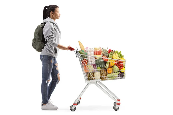 Volledige Profielfoto Van Een Studente Met Eten Een Winkelwagen Geïsoleerd — Stockfoto