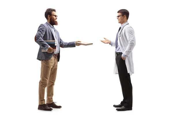 Full Length Profile Shot Bearded Man Giving Book Male Doctor — Stock Photo, Image