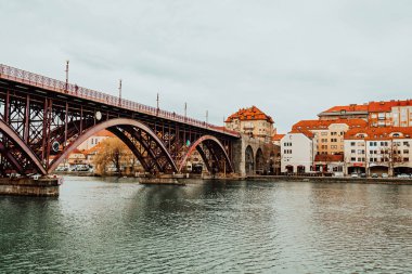 Old Bridge or Main Bridge over the Drava River in the city of Maribor, Slovenia. Europe. clipart