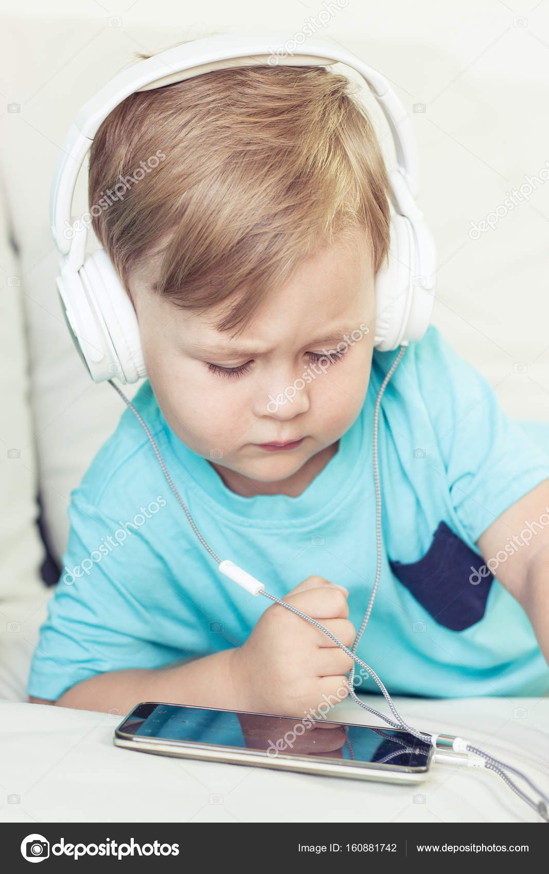 pics Cute 3 Year Olds Boys 3 year old boy sits on the couch and listens to music little cute boy watching cartoons on the phone little boy stock photo image by c karelia89 160881742