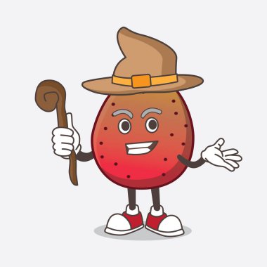 Hindistan inciri karikatür maskot karakterinin sahnede bir cadı olarak fotoğrafı.